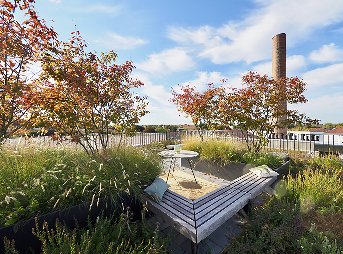 Zu sehen ist eine Begrünung und eine quadratische Lounge zum erholen mit einem Tisch in der Mitte.