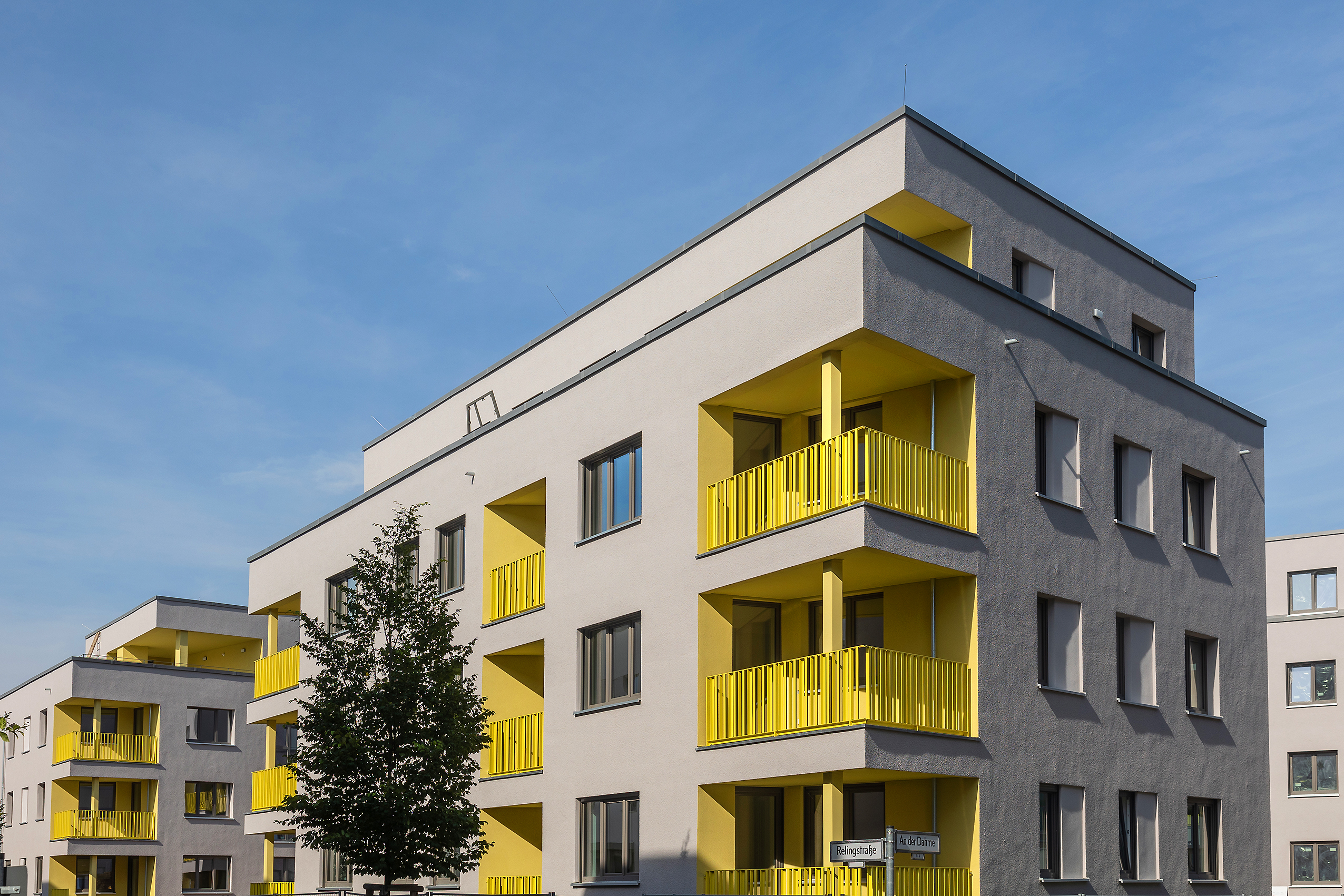 Facades with yellow accents in the Sunny Side residential construction project